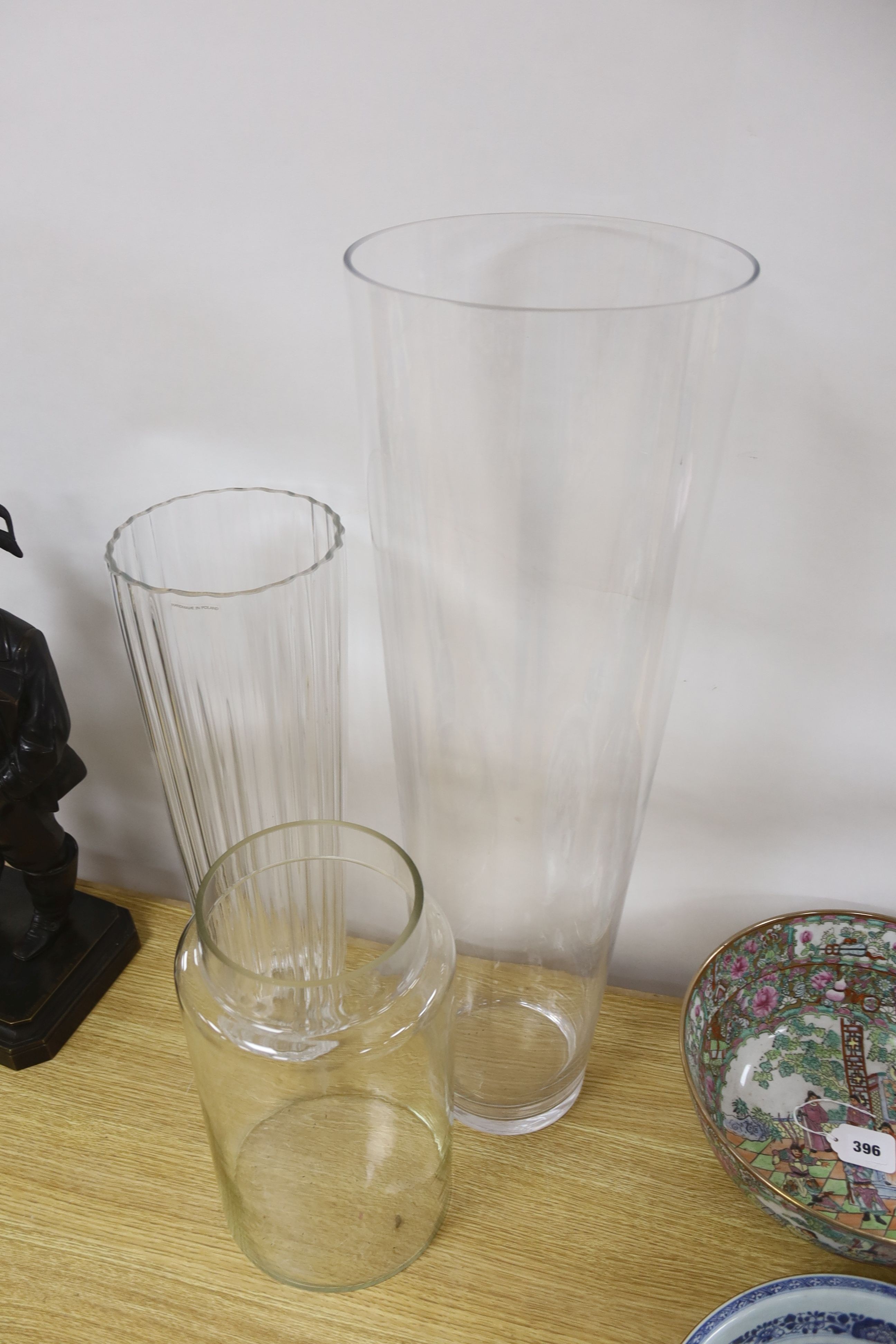 Two large flower arranging glass vases and a glass jar 70cm